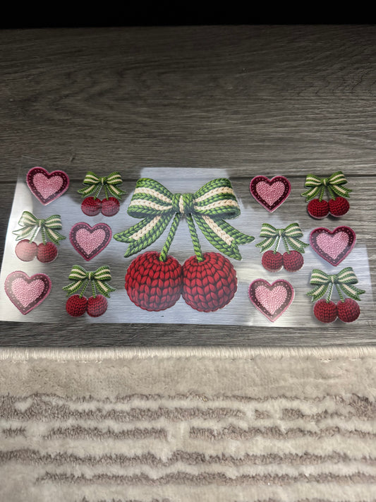Cherry with green bow